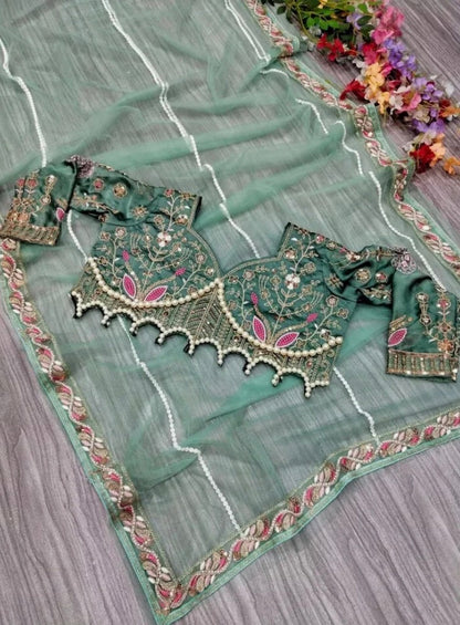Latest Bollywood Style Pastel Green Embroidered Blouse with Pearl Detailing and Premium
Net Saree