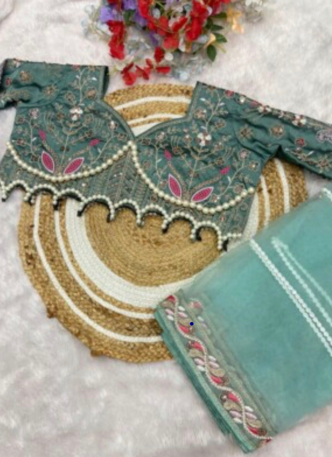 Latest Bollywood Style Pastel Green Embroidered Blouse with Pearl Detailing and Premium
Net Saree